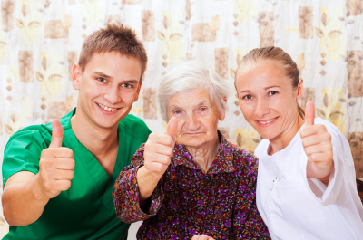 elderly woman with the sweet young caregivers